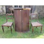 Pair of Regency rosewood dining chairs with cane panelled seats and carved framework, upon fluted