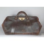 A vintage leather Gladstone bag in reasonable condition.