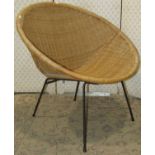 A vintage wicker cone chair raised on tubular steel supports together with a plywood cylindrical bin