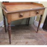 Victorian mahogany side table fitted with two frieze drawers, with three quarter gallery on turned