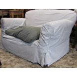 A Edwardian two seat sofa, with rolled arms, upholstered finish and later loose alternating stripped