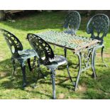Four similar green painted cast aluminium garden chairs with decorative pierced geometric and