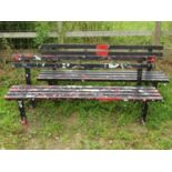 A pair of painted metal municipal/park benches with slatted seats and back rails 180 cm long