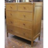 Pale oak chest of three long and two short drawers by Heals, with panelled framework, original