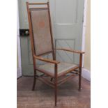 Arts & Crafts elbow chair on turned supports and rails, with Art Nouveau material incorporating