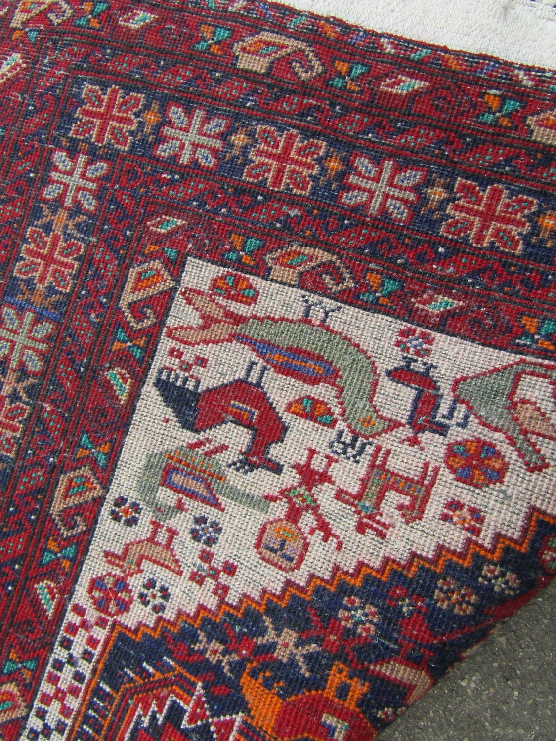 A mid 20th century Beloudj rug with a geometric central diamond shaped medallion with stylised - Image 3 of 3