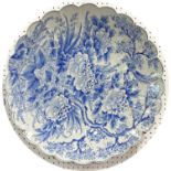 Large Japanese blue and white lobed porcelain dish, decorated with flowers, birds and trees, blue