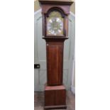 A Georgian oak longcase clock with brass dial and silver chapter ring with engraved detail of