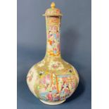 Chinese 19th Century Canton famille rose bottle vase with cover, depicting figures in a garden,