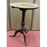 A Georgian oak countrymade snap top occasional table, the circular top 45cm diameter, raised on a