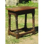 An Old English oak coffin or joint stool, with pegged frame on four turned supports