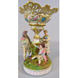 19th century continental bisque table centre of three characters around a central vase, (af) 26cm