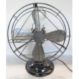 A mid 20th century GEC cooling fan with four blades in an open wire cage.(Sold for parts or