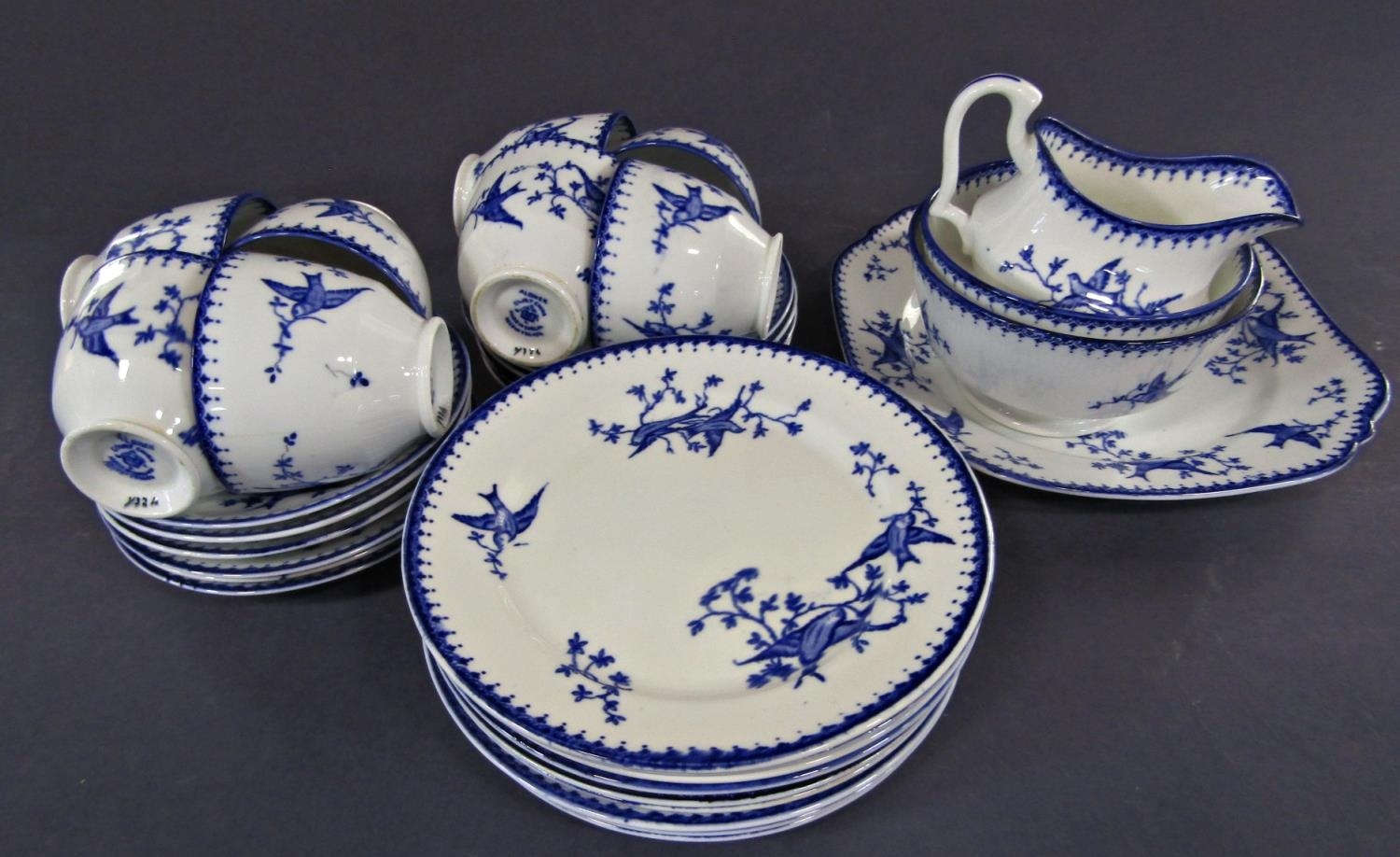 A collection of Aldiner Court china tea wares with blue bird and sprig detail comprising eight cups,