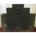 An old cast iron fire back of rectangular and stepped form, dated 1622, raised lettering I & H, 70