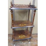 A Victorian figured walnut three tier watnot, with turned supports, 105cm high