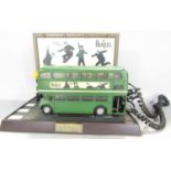 Beatles memorabilia in the form of green No 77 double decker bus telephone stopped in front of The