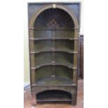 A Georgian pine barrel back cupboard enclosing open shelves with overall olive green and dark gilt