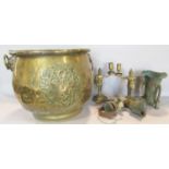 A 19th century brass coal bucket / jardinière, bearing a coat of arms and with lion mask handles,
