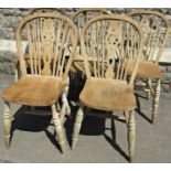 A set of six stripped elm and beechwood hoop and stickback dining chairs with pierced wheel splats