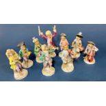 Thirteen German 19th century Dresden porcelain monkey band figures, 14 cm high
