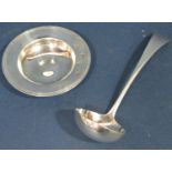 An Asprey & Co Ltd silver sauce ladle, Sheffield 1938, 15cm long, together with a small silver dish,