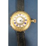 An 18k fob watch (including dust plate and adapted as a wristwatch) half hunter outer dial with