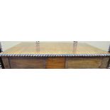 A Regency rosewood sofa table, raised on a stretcher base, the top with gadrooned borders, the
