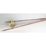 Two vintage two piece fishing rods, without any makers names, both with canvas bags.