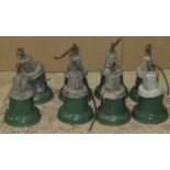 A set of seven vintage industrial hanging ceiling lights with green enamel shades and complete