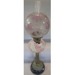 A 19th century Veritas oil lamp, brass reeded column supporting a pink and white striped font and