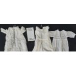 Two vintage white cotton baby gowns decorated with lace and pin tucks and two further gowns together
