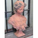 A composition stone bust of an Art Nouveau style maiden with simulated terracotta finish, 47 cm high