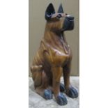 A large almost life size carved hardwood model study of a seated hound 82 cm high