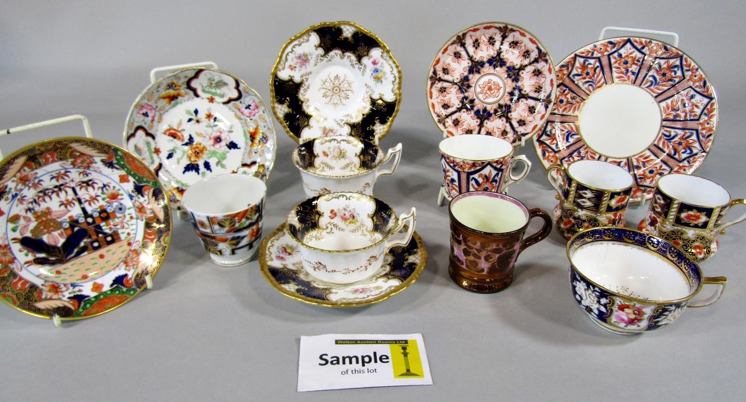 A collection of 19th century Crown Derby and other cabinet cups and saucers with imari and other