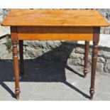 A 19th century stained pine side table of rectangular form the overhanging top with rounded
