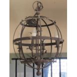 A contemporary open strap iron work globular shaped hanging ceiling light with four candle bulb