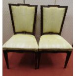 A pair of 19th century continental mahogany side chairs with carved framework, upholstered seas