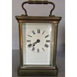 A simple French brass carriage clock with eight day time piece