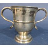 A silver double handled trophy, London 1769, maker Thomas Wallace II, 12.3cm high x 10cm diameter (