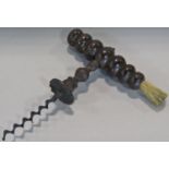 An antique bobbin turned mahogany corkscrew with badger hair brush, handle 12cm x 15.5cm, and a