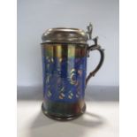 A copper lustre ceramic tankard supporting a French white metal lid and thumb piece, surmounted by a
