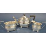 An early 20th century Georgian style three piece silver tea service, London 1912 maker Munsey &