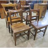 A 19th century country made oak bar back open elbow chair with solid seat raised on square tapered