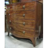 A Regency mahogany bow fronted bedroom chest of two short over three long graduated drawers with