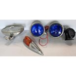 A pair of chromium plated blue glass car lamps, a single chromium plated orange indicator light, a