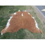 A Hereford cow hide rug, 210cm x 170cm