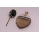 Carved banded agate heart shaped pendant with yellow metal loop, together with a further cabochon