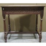 A Victorian oak side table, with repeating carved foliate detail to top and frieze and incorporating