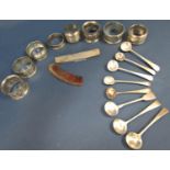 Eight various silver napkins rings, eight various silver mustard spoons and a silver comb cover, 8.